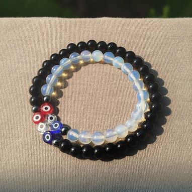 Pulseras en pareja piedra lunar, onix y ojos trucos - Img 105789646