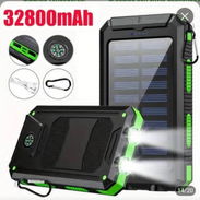 Cargador portátil de 32800mlh Con panel solar ,varios puertos de carga y linterna  28 usd/ - Img 56879539