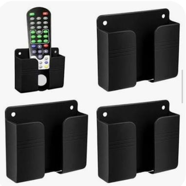 Soporte negro plástico de pared para celulares, mandos diversos - Img 124864252
