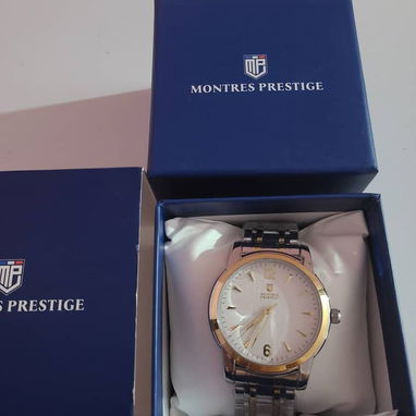 Reloj Montres Prestige de cara blanca y números dorados. - 2/2