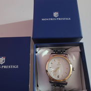 Reloj Montres Prestige de cara blanca y números dorados. - Img 57546589