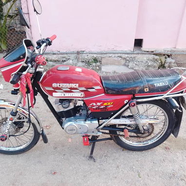 Se vende susuki ax100 con chapa y pacotillas al 100 todo listo para traspaso o poder - Img 123927676