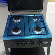 Cocina d 4 hornillas con bace y tapa nuevas en caja - Img 57693245