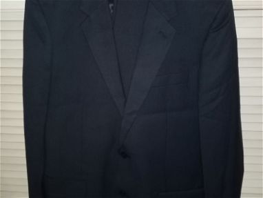 Se vende un traje nuevo azul oscuro, chaqueta talla M y pantalón 34  hecho en España, con todas sus etiquetas originales - Img main-image-45761216