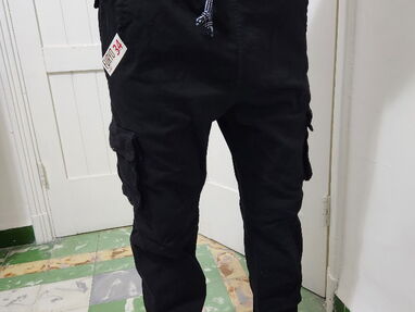Pantalones cuatro puertas con puño a la moda talla 34 - Img main-image